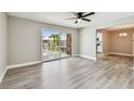 Bright living room with new floors and a sliding door to a balcony overlooking the pool at 3515 41St S Ter # 224, St Petersburg, FL 33711