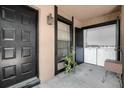 Screened porch includes entry, laundry area with full sized washer dryer, and exterior light fixture at 4004 Dream Oak Pl # 102, Tampa, FL 33613