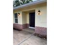 Inviting front entrance with decorative lighting and charming brick accents at 5281 Venetian Ne Blvd, St Petersburg, FL 33703