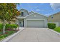 Charming single-Gathering home with a well-maintained lawn and a two-car garage at 6512 Trent Creek Dr, Sun City Center, FL 33573