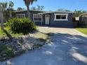Charming single-story home with well-maintained landscaping and a quaint front entrance at 7313 Royal Palm Dr, New Port Richey, FL 34652