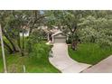 Charming home with a long driveway and mature trees at 8060 Timberlake Ave, Spring Hill, FL 34606