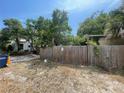 Home's backyard with a wooden fence surrounding the property at 834 Grand Central St, Clearwater, FL 33756