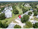 Aerial view of property with a golf course nearby, surrounded by lush greenery and other well-kept homes at 860 Maclaren N Dr # A, Palm Harbor, FL 34684