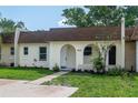 Inviting single-story home featuring an arched entryway, manicured lawn, and neutral paint scheme at 9831 83Rd Way, Seminole, FL 33777