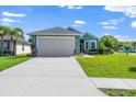Charming single Gathering home with well-manicured lawn and two-car garage, situated on a sunny lot at 11016 Kiskadee Cir, New Port Richey, FL 34654