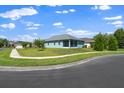 Relax on the screened lanai overlooking the serene backyard, perfect for outdoor entertaining and leisure at 11016 Kiskadee Cir, New Port Richey, FL 34654