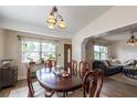 Inviting dining room featuring a classic wood table, chairs, and decorative light fixture at 1512 56Th N Ave, St Petersburg, FL 33703