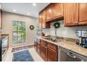 Bright kitchen with granite countertops and an undermount stainless steel sink at 1515 Bayshore Blvd # 38, Dunedin, FL 34698