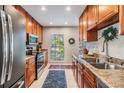 Well-lit kitchen featuring granite countertops and stainless steel appliances at 1515 Bayshore Blvd # 38, Dunedin, FL 34698