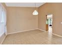 Bright dining room with tile flooring and view into other rooms at 1604 Comfy Ct, Sun City Center, FL 33573