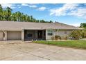 Charming single-story home with well-manicured lawn, driveway and attached garage at 1604 Comfy Ct, Sun City Center, FL 33573