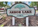 Arbor Lake community sign with decorative tree emblem at 1613 Long Pond Dr, Valrico, FL 33594