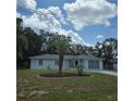 Single-story home with a healthy lawn, tasteful landscaping, and inviting curb appeal at 2226 Giralda Ave, Spring Hill, FL 34606