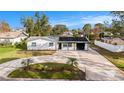 Beautiful home with large driveway, freshly painted exterior, and updated landscaping at 239 Freeport Ne Ave, St Petersburg, FL 33702