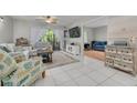 Bright living room with tile floors and a seamless flow into adjacent living spaces at 3114 Lake Pine Way # G1, Tarpon Springs, FL 34688