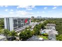 Upscale condominium building with city views and surrounded by mature trees and manicured landscaping at 3211 W Swann Avenue # 707, Tampa, FL 33609