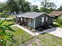 This single-story home features a well-maintained lawn and neutral paint scheme at 37045 North Ave, Dade City, FL 33523