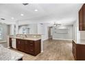 Spacious kitchen featuring granite countertops and a view into the living area for open-concept living at 3917 Casaba Loop, Valrico, FL 33596