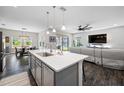Open-concept kitchen with island, dining area, and a seamless flow to the living room at 4633 Ballantrae Blvd, Land O Lakes, FL 34638