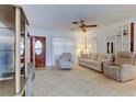 Spacious living room featuring soft carpeting and comfortable seating at 6409 41St N Ave, St Petersburg, FL 33709