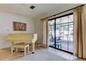 Room with piano and access to enclosed patio, view of pool area at 6409 41St N Ave, St Petersburg, FL 33709