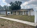 Classic single story home with a well-maintained front yard and a welcoming entrance at 7206 Reindeer Rd, Tampa, FL 33619