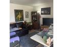 Comfortable living room featuring ample seating, art and a cozy atmosphere at 7206 Reindeer Rd, Tampa, FL 33619