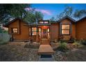 The front of the home is illuminated at dusk, inviting visitors at 1004 Black Knight Dr, Valrico, FL 33594