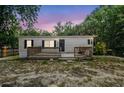 Exterior of home features a small porch at 10537 Fran St, New Port Richey, FL 34654