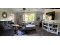Bright living room featuring modern furnishings, wood floors, and a cozy atmosphere at 11107 Riverview Dr, Riverview, FL 33578