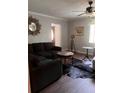 Inviting living room with comfortable seating, stylish accents, and wood-look floors at 11107 Riverview Dr, Riverview, FL 33578