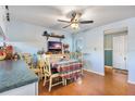 Kitchen area featuring a cozy dining table, ceiling fan, and natural light at 11296 90Th Ave, Seminole, FL 33772