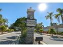 Stone monument sign for the Symmes Grove neighborhood with mature landscaping at 11627 Ivy Flower Loop, Riverview, FL 33578