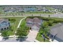 An aerial view of a home showcasing its well-maintained lawn and landscaping in a Gathering-friendly neighborhood at 11904 Greenchop Pl, Riverview, FL 33579