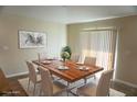 Dining room with a decorative light fixture and large sliding glass door at 15709 Demory Point Pl, Ruskin, FL 33573