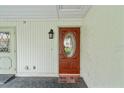 Inviting front door with a stained-glass oval window and matching side door at 2214 Highclere Cir # 6, Sun City Center, FL 33573