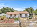 Charming single-story home featuring desert landscaping and a fenced front yard at 2233 Rightaway Ln, Plant City, FL 33565