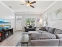 Bright living room featuring two sofas and neutral walls and light-colored floors at 311 W Ida St, Tampa, FL 33603
