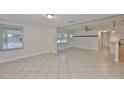 Spacious living area featuring tile floors, large windows, and ample natural light at 3209 W Tyson Ave, Tampa, FL 33611