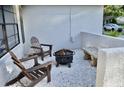 Cozy outdoor patio featuring comfortable seating and a charming stone bench at 34 Harbor Oaks Cir, Safety Harbor, FL 34695