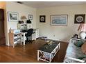 Comfortable living room featuring a workstation, plush seating, and stylish decor at 405 Bryn Mawr Is, Bradenton, FL 34207