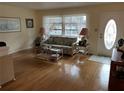 Cozy living room featuring a comfortable sofa, elegant lamps, and a decorative glass door at 405 Bryn Mawr Is, Bradenton, FL 34207