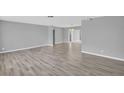Spacious living room featuring sleek flooring, neutral paint, and ample natural light at 4200 49Th S Ave, St Petersburg, FL 33711