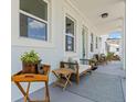 Inviting covered front porch with comfortable seating, stylish rug, and elegant decor at 4513 21St N St, St Petersburg, FL 33714