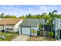 Inviting single-Gathering home with a well-manicured lawn, mature landscaping, and one car garage at 4521 Tidal Pond Rd, New Port Richey, FL 34652