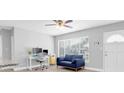 Bright living space showcasing a work space, neutral colors, and ample natural light at 5685 35Th N Ave, St Petersburg, FL 33710