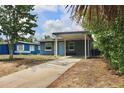 This charming home features a convenient covered carport and a lovely shade tree at 7307 34Th N Ave, St Petersburg, FL 33710