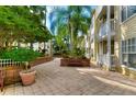 Landscaped courtyard with benches, creating a serene and inviting outdoor space for residents in Hyde Park Walk at 800 S Dakota Ave # 429, Tampa, FL 33606