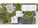 Aerial view of building surrounded by greenery and parking lot at 1028 Apollo Beach Blvd # 203, Apollo Beach, FL 33572
